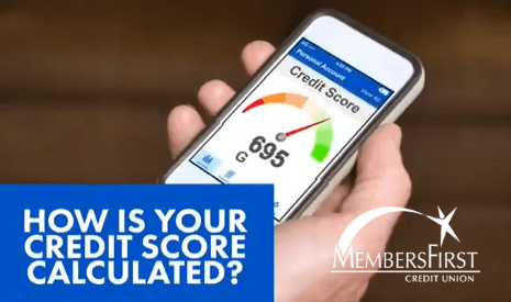 person holding cell phone showing credit score of 695 on screen