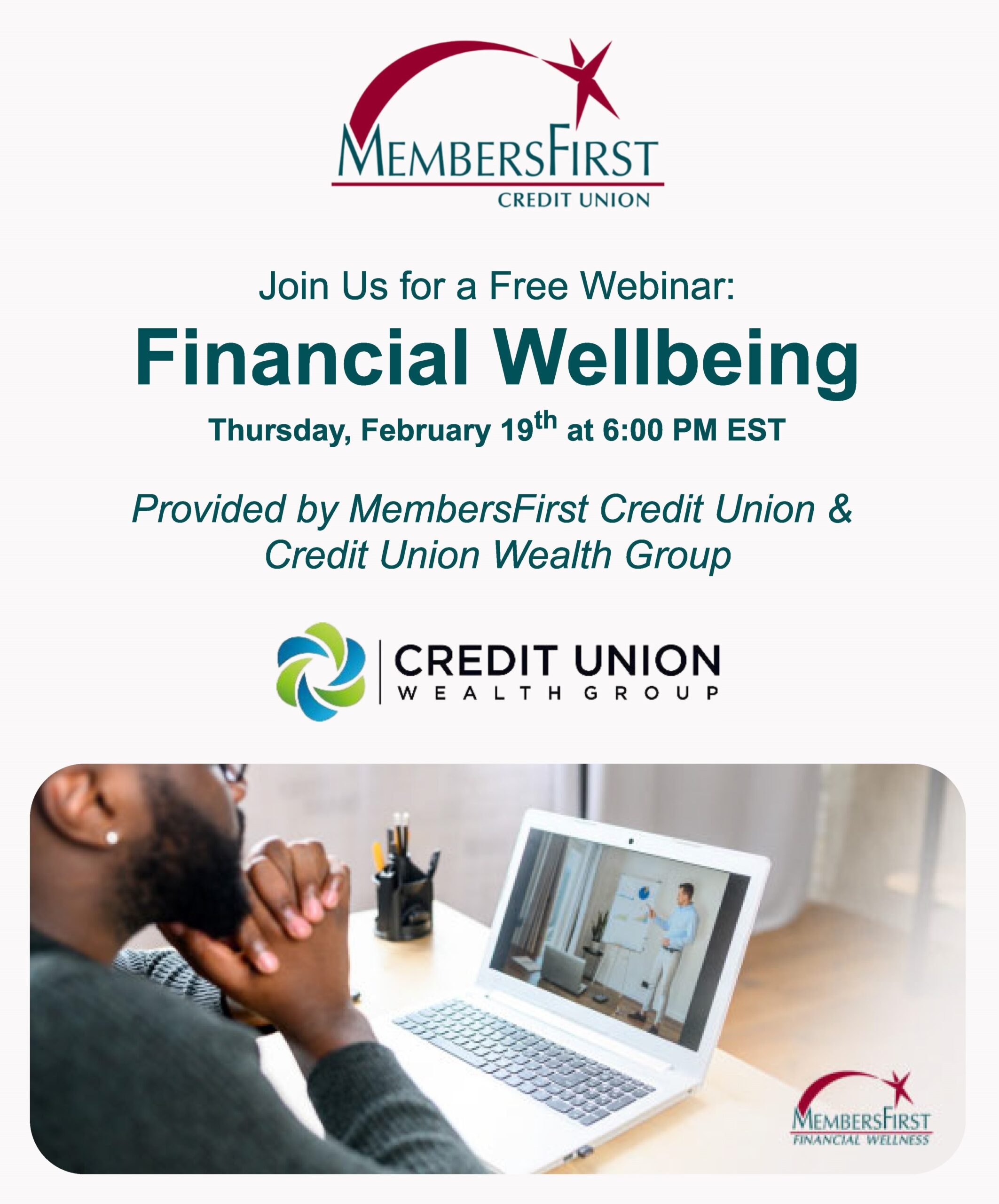 Financial Wellbeing Webinar - Social african american man sitting at a desk with hands folded and facing an open laptop watching a webinar. there are pens in a black cup at the top left of the desk. the man is wearing a grey sweatshirt.